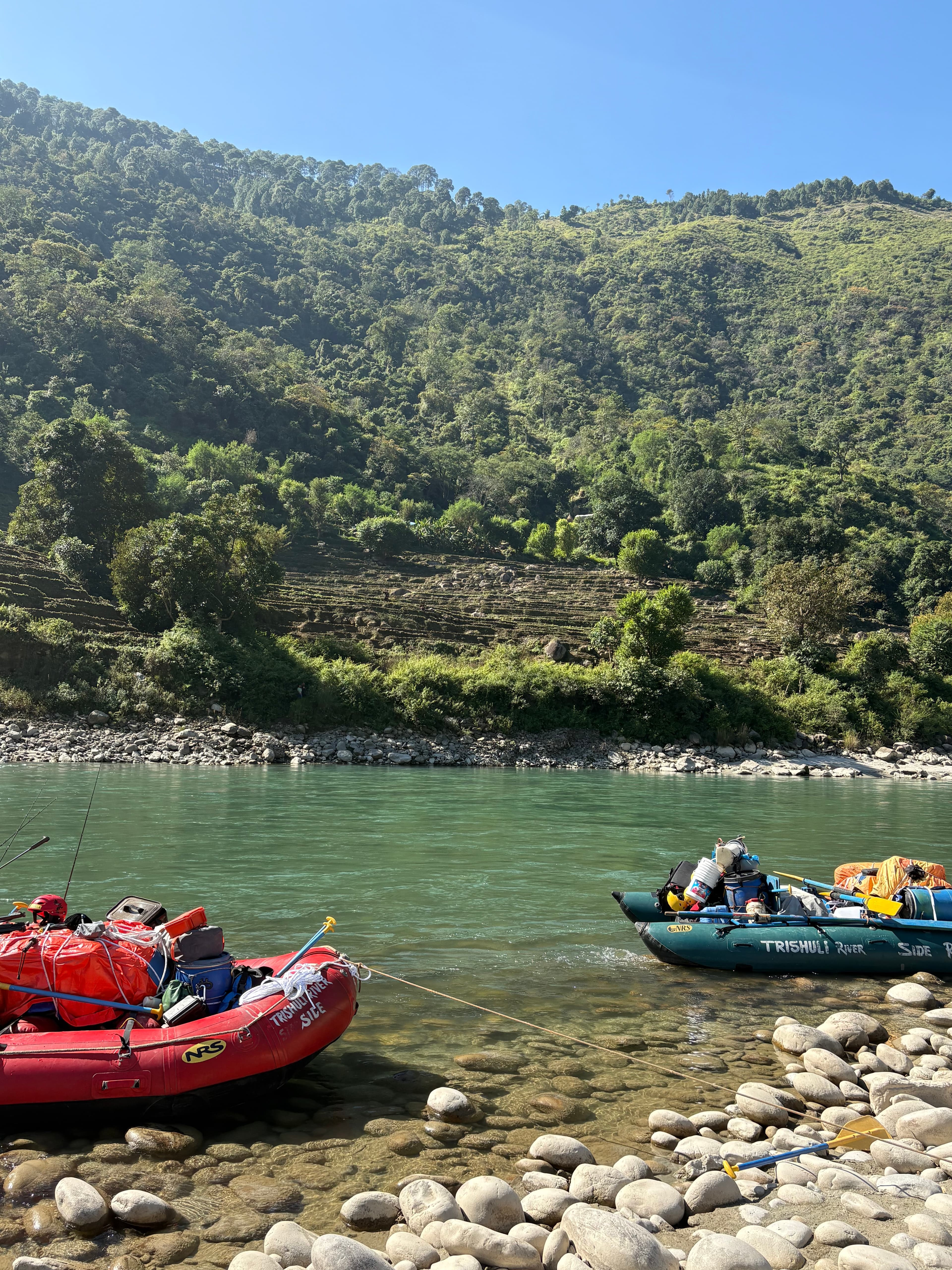 Boats resting by the riverbank
